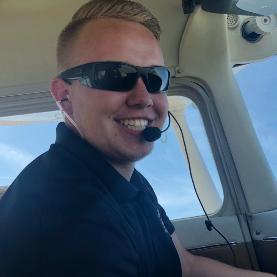 Flight instructor candidate in the cockpit with headset at Dayton Aviation Services